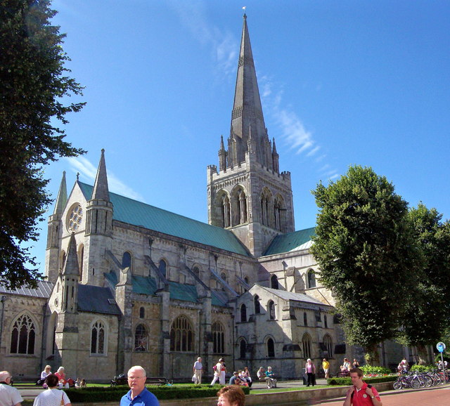 Chichester Cathedral from the south-east, late afternoon. The spire (rebuilt by Sir George Gilbert Scott, 1866) rises 277 feet above the city. Photographed by Len Williams, 2012.